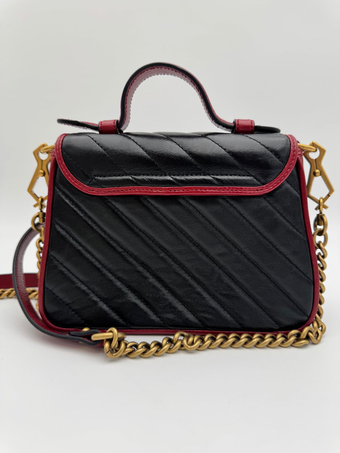 Gucci GG Marmont Torchon Mini Top Handle Bag - Black Quilted Leather with Cerise Red Trim