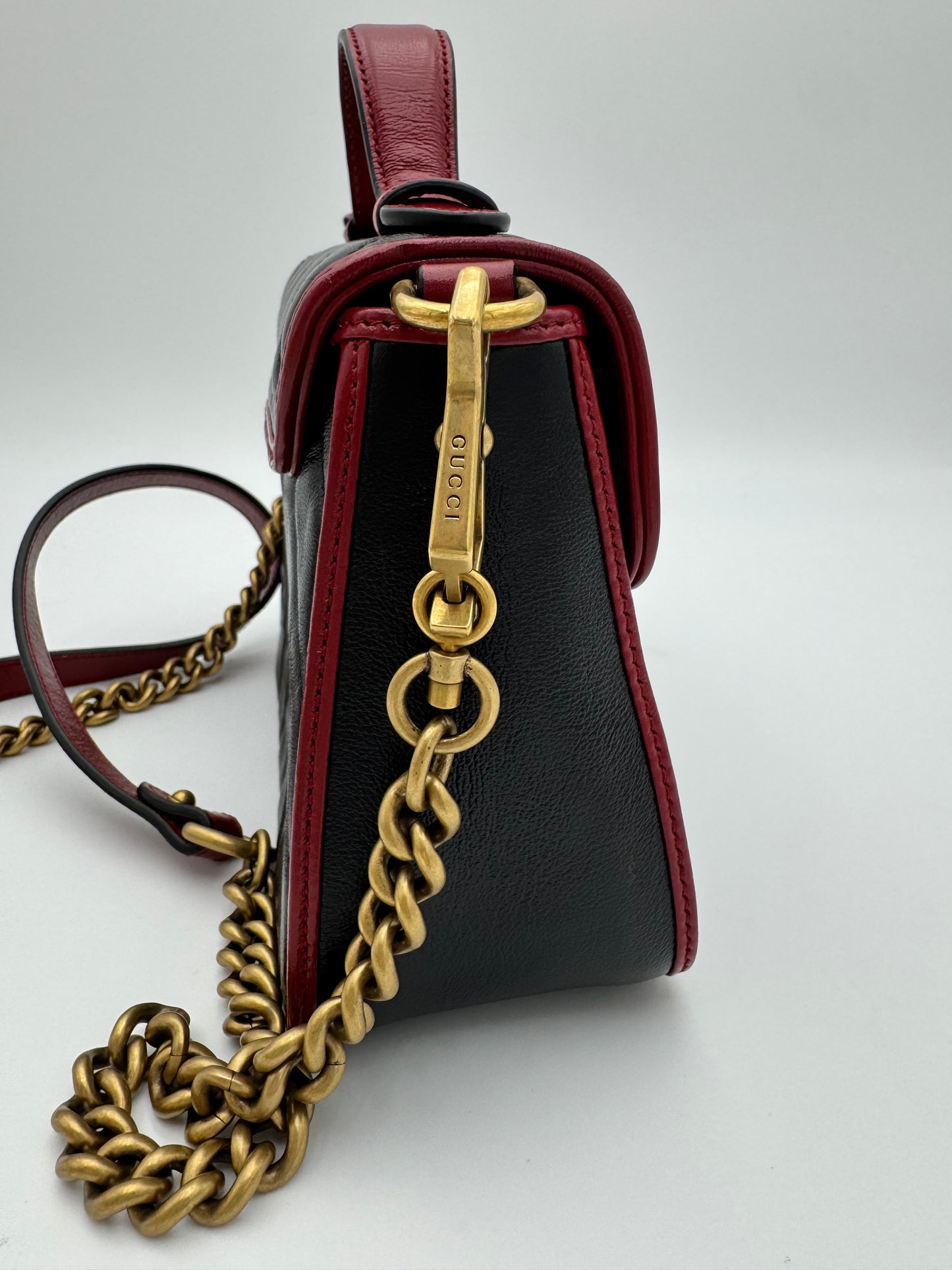 Gucci GG Marmont Torchon Mini Top Handle Bag - Black Quilted Leather with Cerise Red Trim